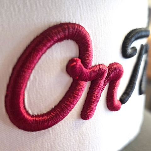 3D puff embroidery on a white cap